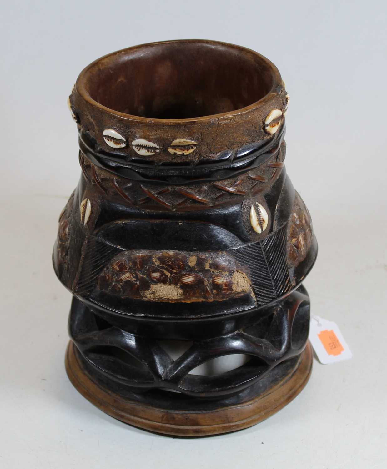 Lot 164 - A carved softwood and ebonised tribal style...