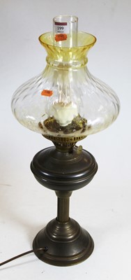 Lot 199 - An early 20th century brass pedestal oil lamp,...