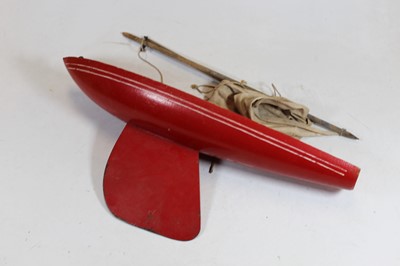 Lot 201 - A mid-20th century red painted pond yacht, 46cm