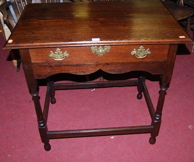 Lot 1105 - A 19th century provincial oak single drawer...