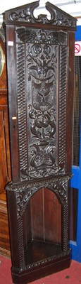 Lot 1110 - A stained and relief carved oak freestanding...