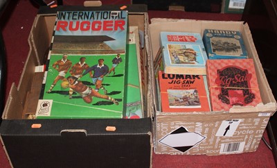 Lot 235 - Two boxes of childrens toys and games, to...