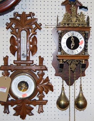 Lot 1119 - A Swiss carved walnut two dial aneroid...