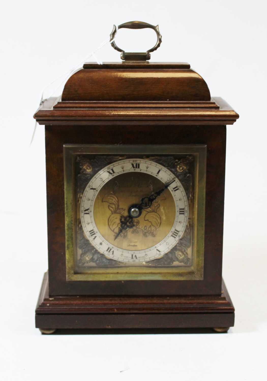 Lot 96 - A walnut cased mantel clock, in the 18th...