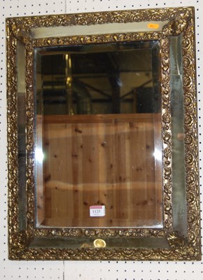 Lot 1125 - An early 20th century embossed brass applied...