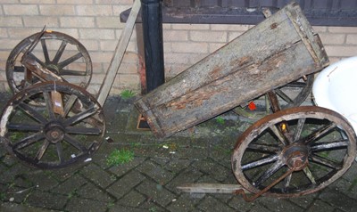 Lot 1138 - A pine and wrought iron bound cart (with...