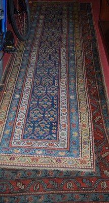 Lot 1151 - Two Persian woollen blue ground hall runners,...