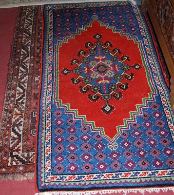 Lot 1152 - A Persian woollen brown ground Tabriz rug, 170...