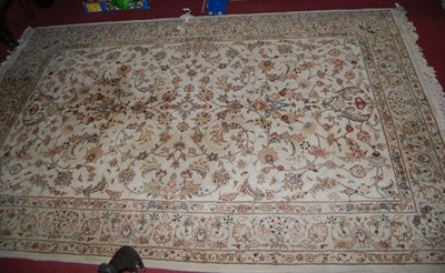 Lot 1153 - A Persian style machine woven cream ground...