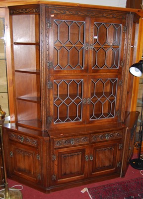 Lot 1192 - A contemporary Old Charm linenfold moulded oak...