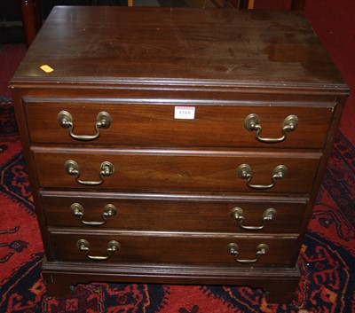Lot 1210 - A contemporary mahogany table top chest of...