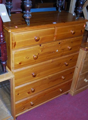 Lot 1215 - A modern pine chest of two short over four...