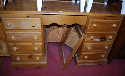 Lot 1221 - A modern pine kneehole swing mirror back...