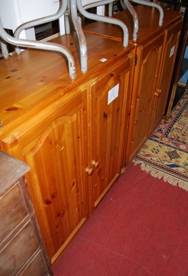 Lot 1237 - A pair of modern pine low double door side...