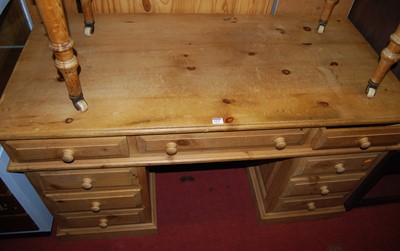Lot 1271 - A modern pine twin pedestal writing desk,...
