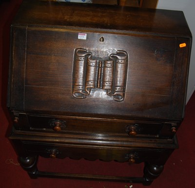 Lot 1272 - A joined and moulded oak slopefront writing...