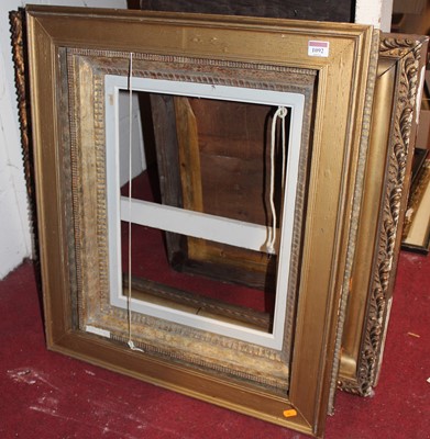 Lot 1092 - A gilt composition picture frame, circa 1900,...