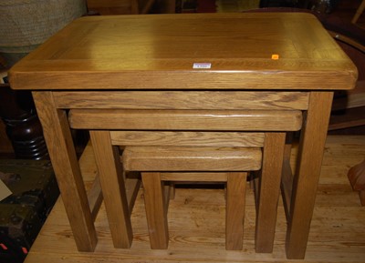 Lot 1306 - A contemporary oak nest of three occasional...