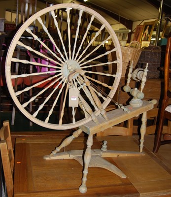 Lot 1318 - A faded pine and beech spinning wheel