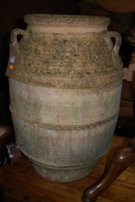 Lot 1334 - A large terracotta three handled olive jar, of...