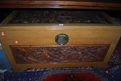 Lot 1352 - An Eastern relief carved camphor wood hinge...