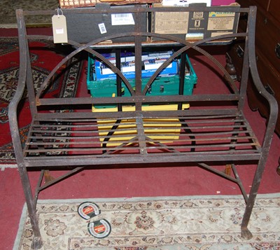 Lot 1364 - A Regency style iron two-seater garden bench,...