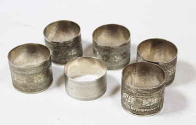 Lot 254 - Five various Middle Eastern white metal napkin...