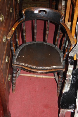 Lot 1381 - A 1930s beech tub elbow chair with studded...