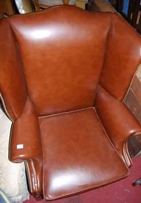 Lot 1383 - A contemporary tan leather and brass studded...