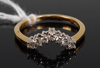 Lot 349 - An 18ct gold diamond wishbone ring, set with...