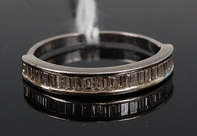 Lot 342 - A platinum diamond set half eternity ring,...