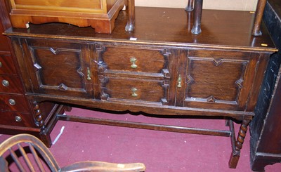 Lot 1411 - A 1920s geometric moulded oak sideboard,...