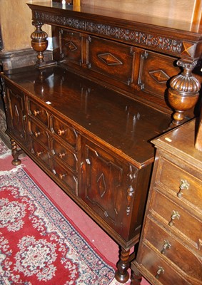 Lot 1428 - An early 20th century geometric moulded oak...