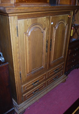 Lot 1435 - A modern Belgian oak double door side cupboard,...
