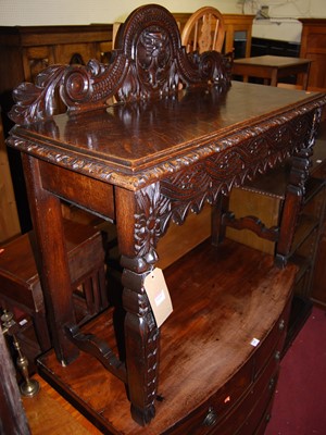 Lot 1439 - A late 19th century heavily carved oak...