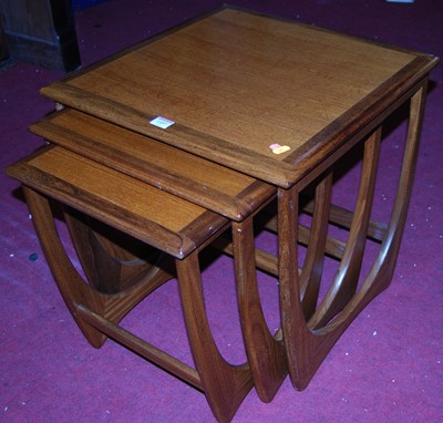Lot 1457 - A 1970s G-Plan teak nest of three occasional...