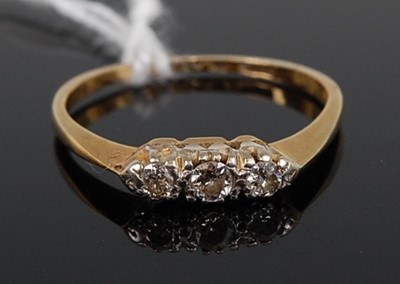 Lot 347 - An 18ct gold diamond three-stone ring, the...