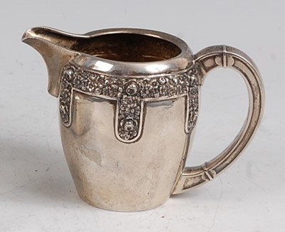 Lot 97 - An early 20th century German silver cream jug,...