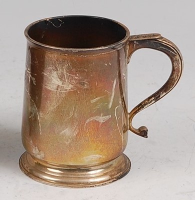 Lot 107 - An early 20th century silver christening mug,...