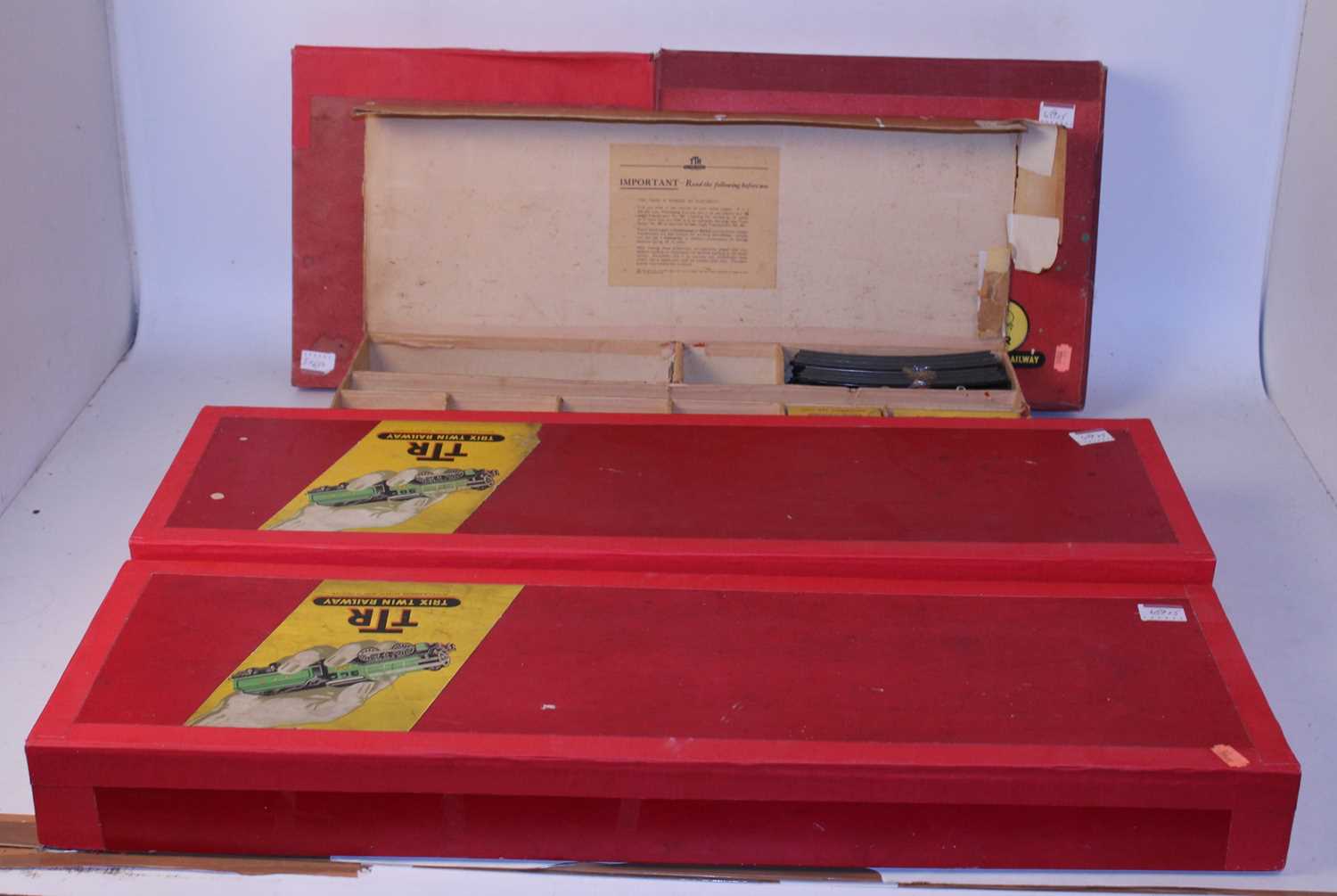 Lot 659 - A pre-war Trix Twin set box and 4 various red...