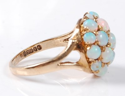 Lot 2509 - A 9ct yellow gold and opal bombe ring,...