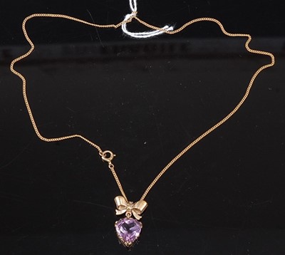 Lot 305 - A 9ct yellow gold and amethyst pendant, having...