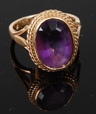 Lot 321 - A 9ct yellow gold oval amethyst dress ring,...