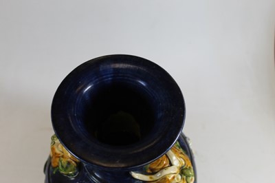 Lot 7 - A Chinese style pottery vase, on a blue ground,...