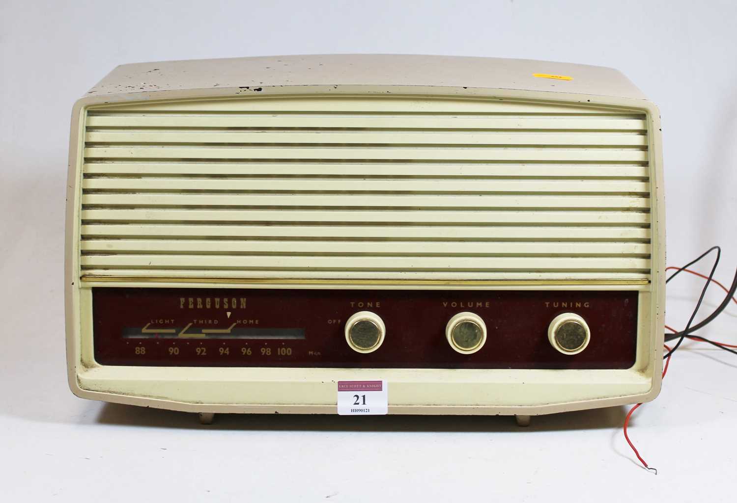 Lot 21 - A 1950s Ferguson radio, housed in a beige...