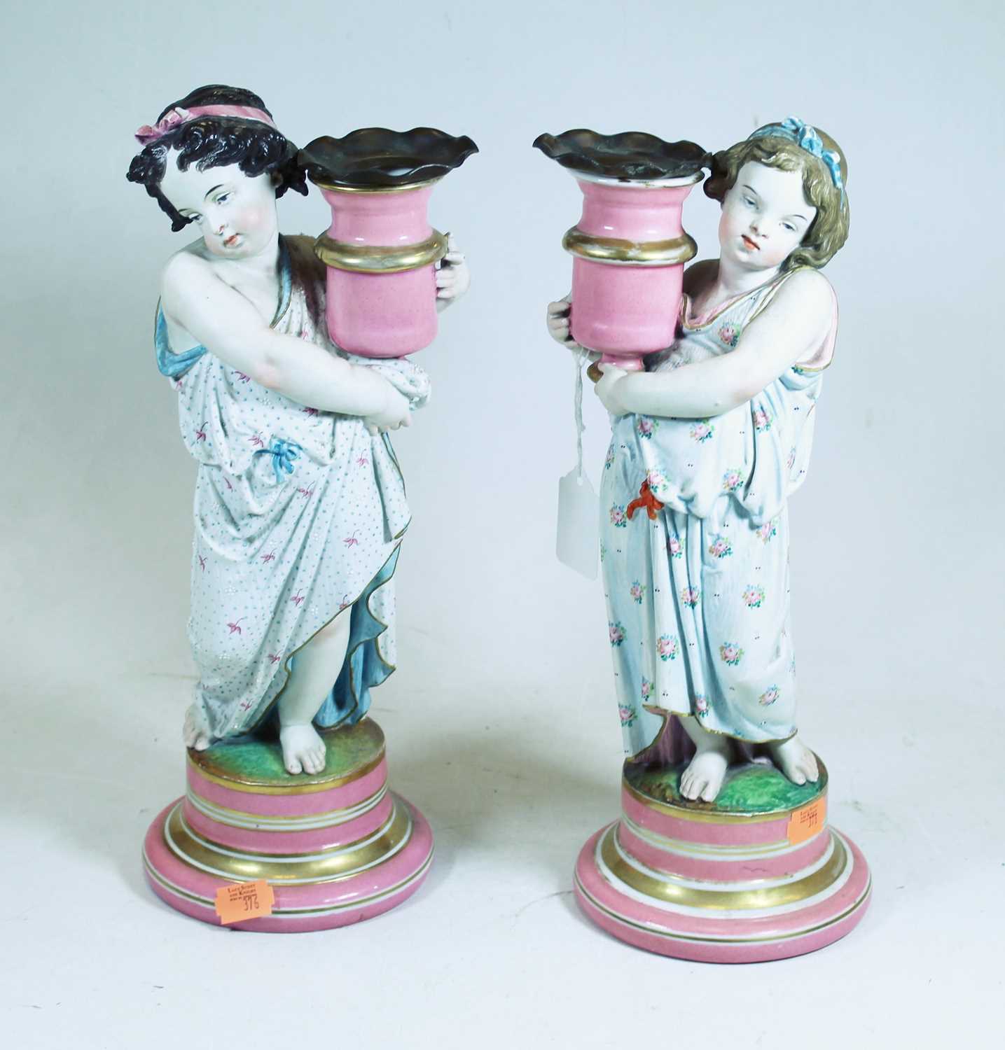 Lot 50 - A pair of late Victorian figural porcelain...