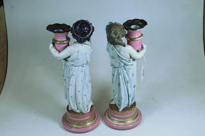 Lot 50 - A pair of late Victorian figural porcelain...