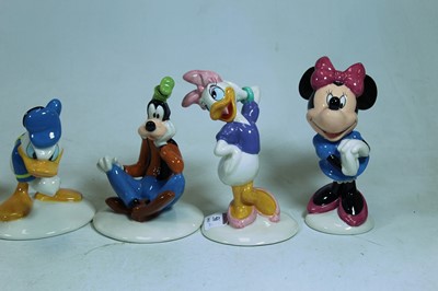 Lot 56 - A set of six Royal Doulton Disney figures The...
