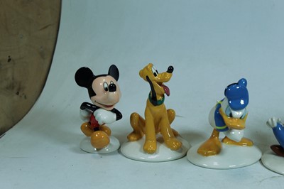 Lot 56 - A set of six Royal Doulton Disney figures The...