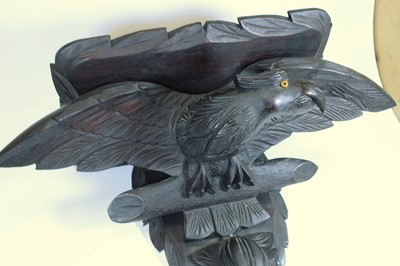 Lot 96 - A Victorian style ebonised wall bracket carved...